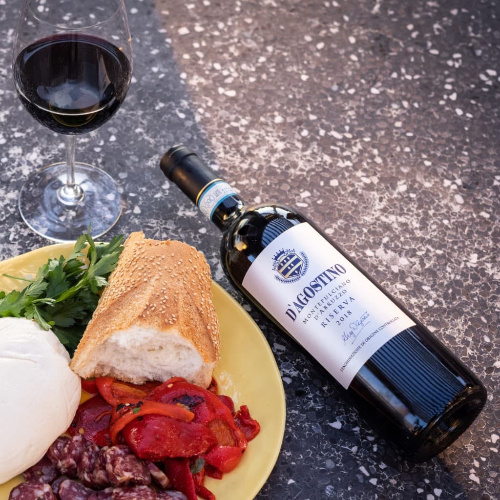 Premium wine product photography — DTC merchandising built into the site